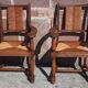 Pair of oak armchairs with straw seats and backs.