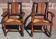 Pair of oak armchairs with straw seats and backs.