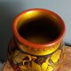 Khokhloma vase, Russian lacquered wood craftsmanship, hand-painted floral decoration.
