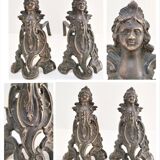 Pair of bronze andirons with black patina, 19th century, female caryatids