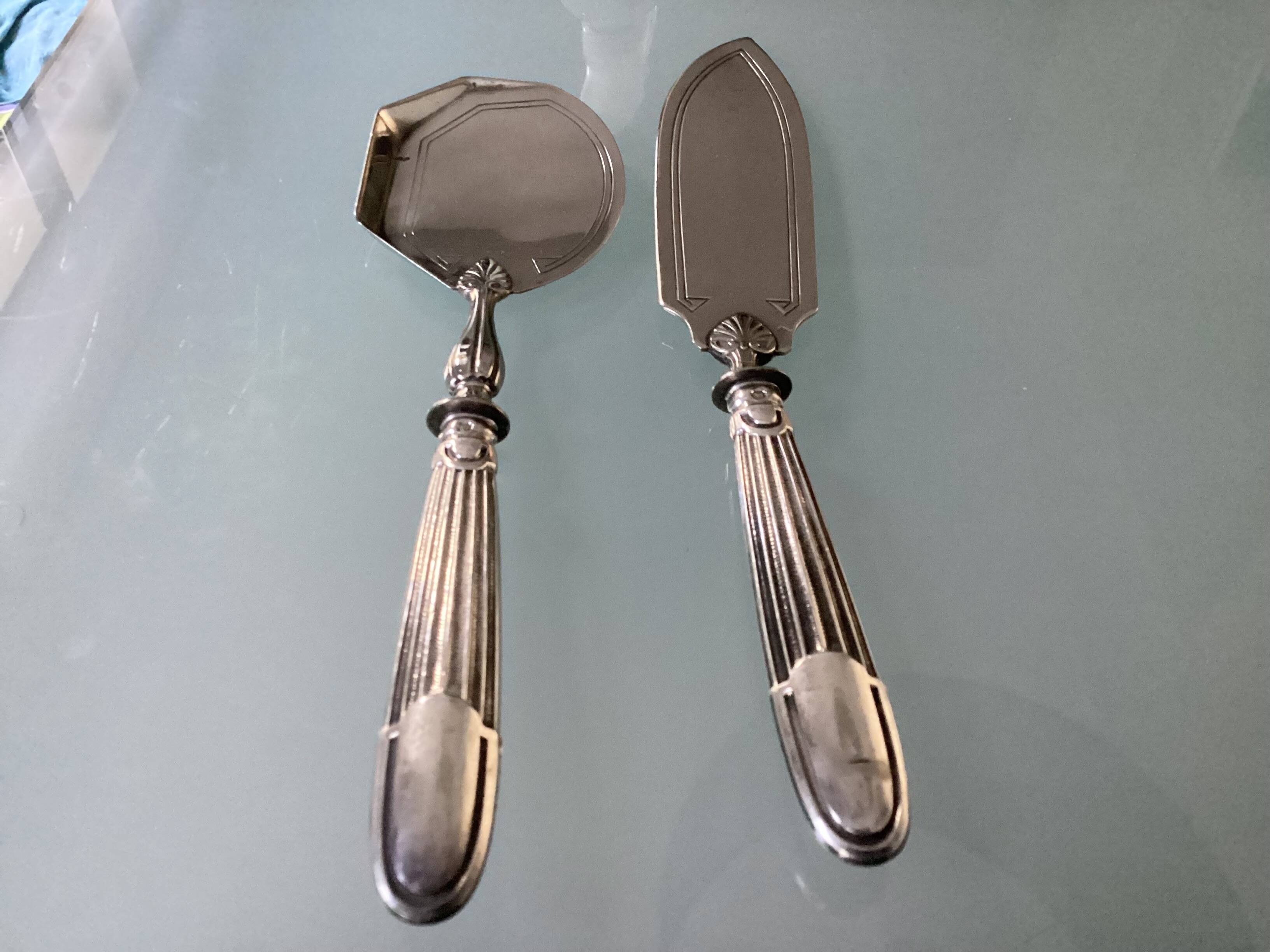 Antique silver serving cutlery with a Minerva hallmark.