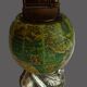 Vintage antique lighter with a globe and silver-plated stand.