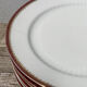 6 flat plates in gilded porcelain and burgundy