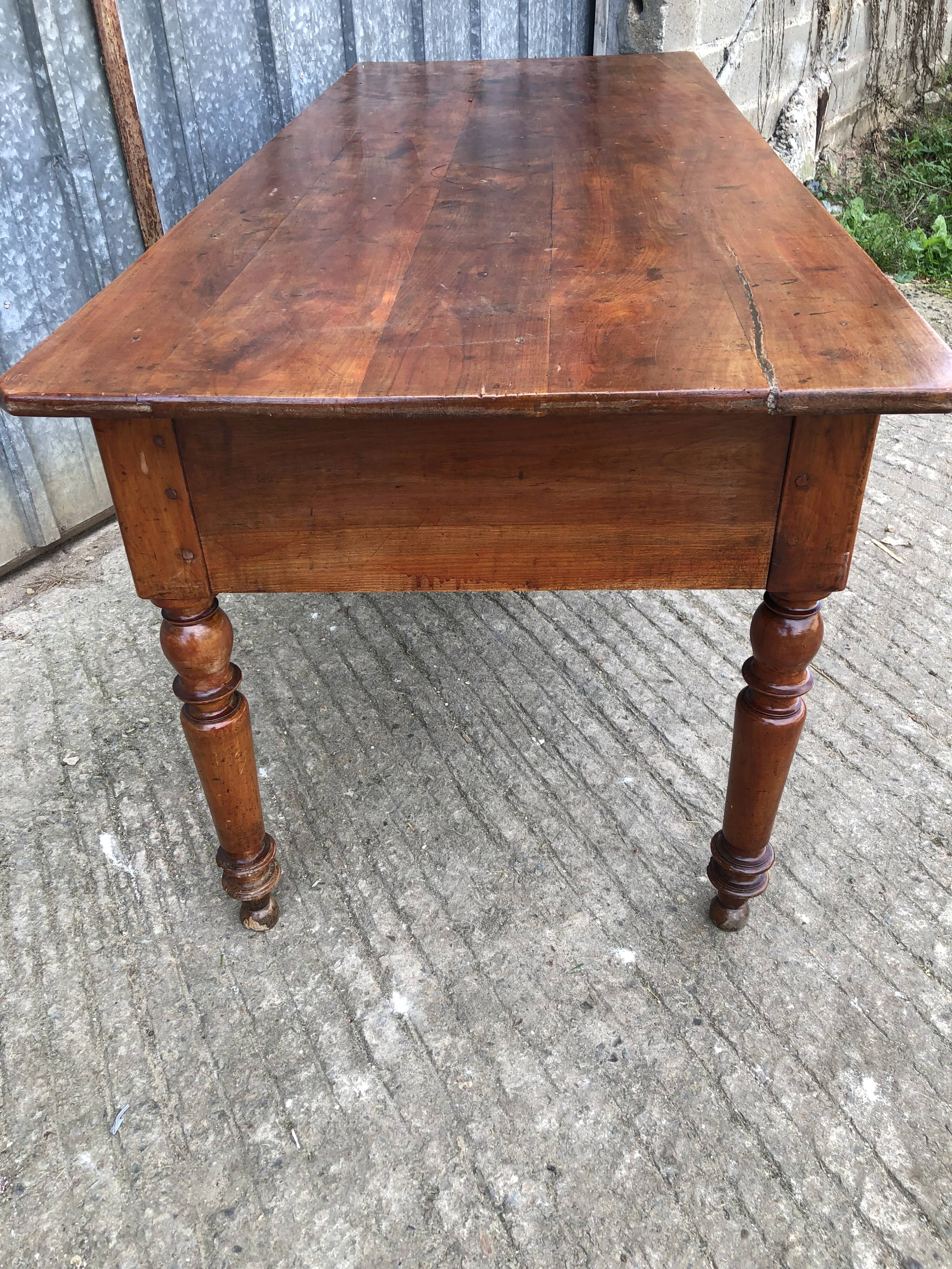 Old farmhouse table in solid cherry wood with 2 front drawers.