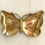 Empty butterfly brass pocket