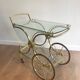 Neo classical style table in silver and gold metal and glass