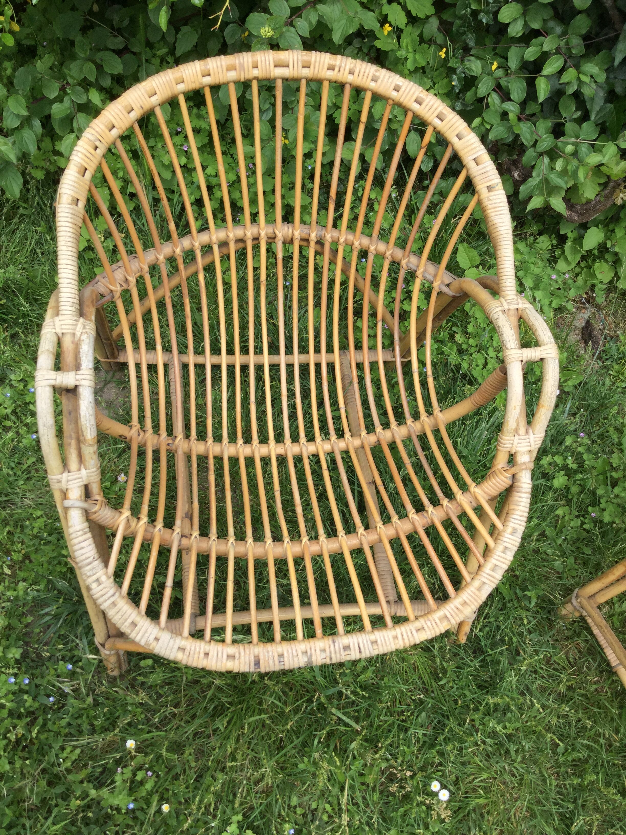 A pair of rattan armchairs