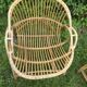 A pair of rattan armchairs
