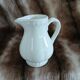 2 antique pitchers in white earthenware