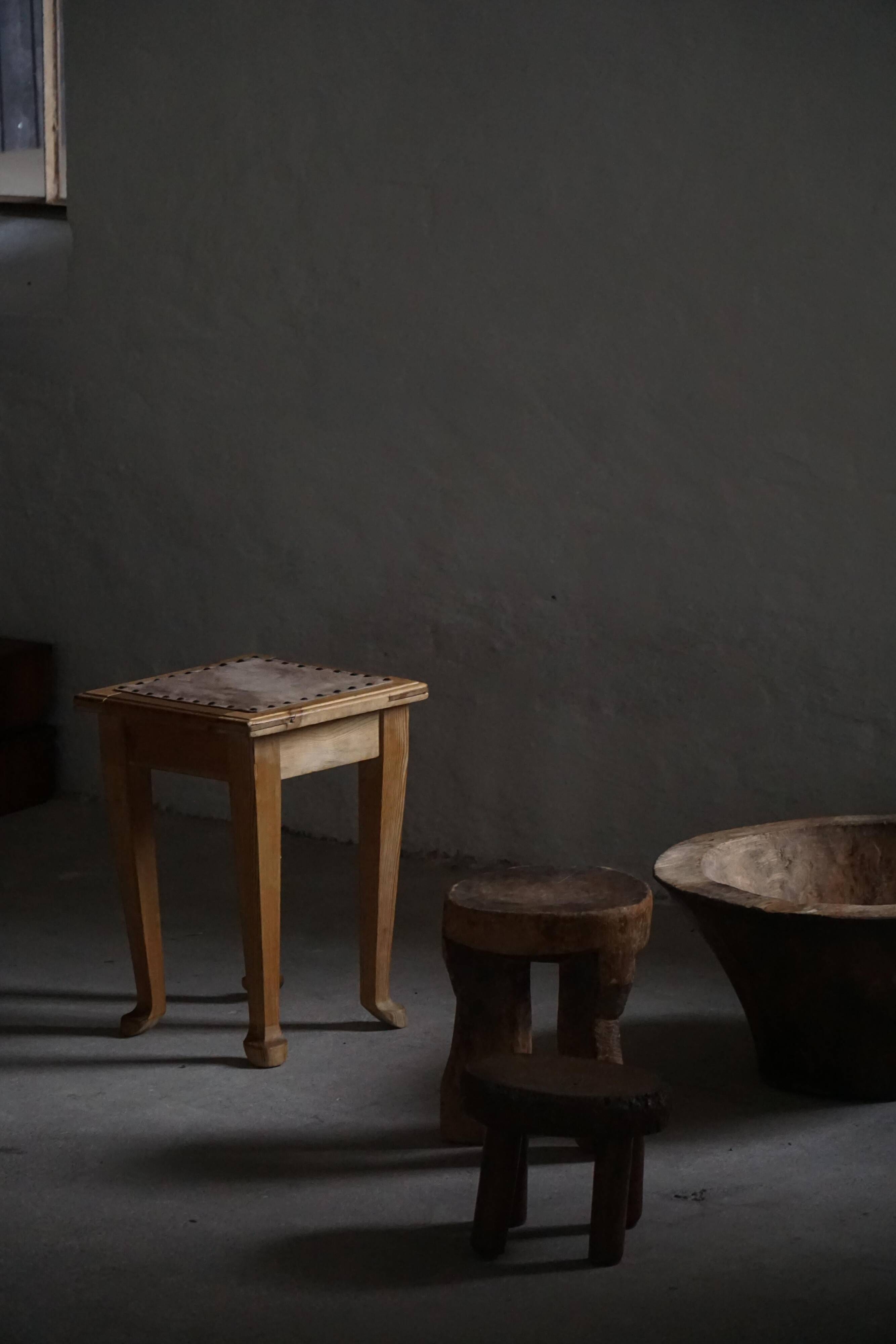 A pair of antique Danish pine stools from the late 19th century.