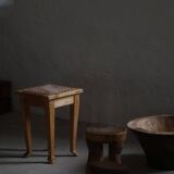 A pair of antique Danish pine stools from the late 19th century.