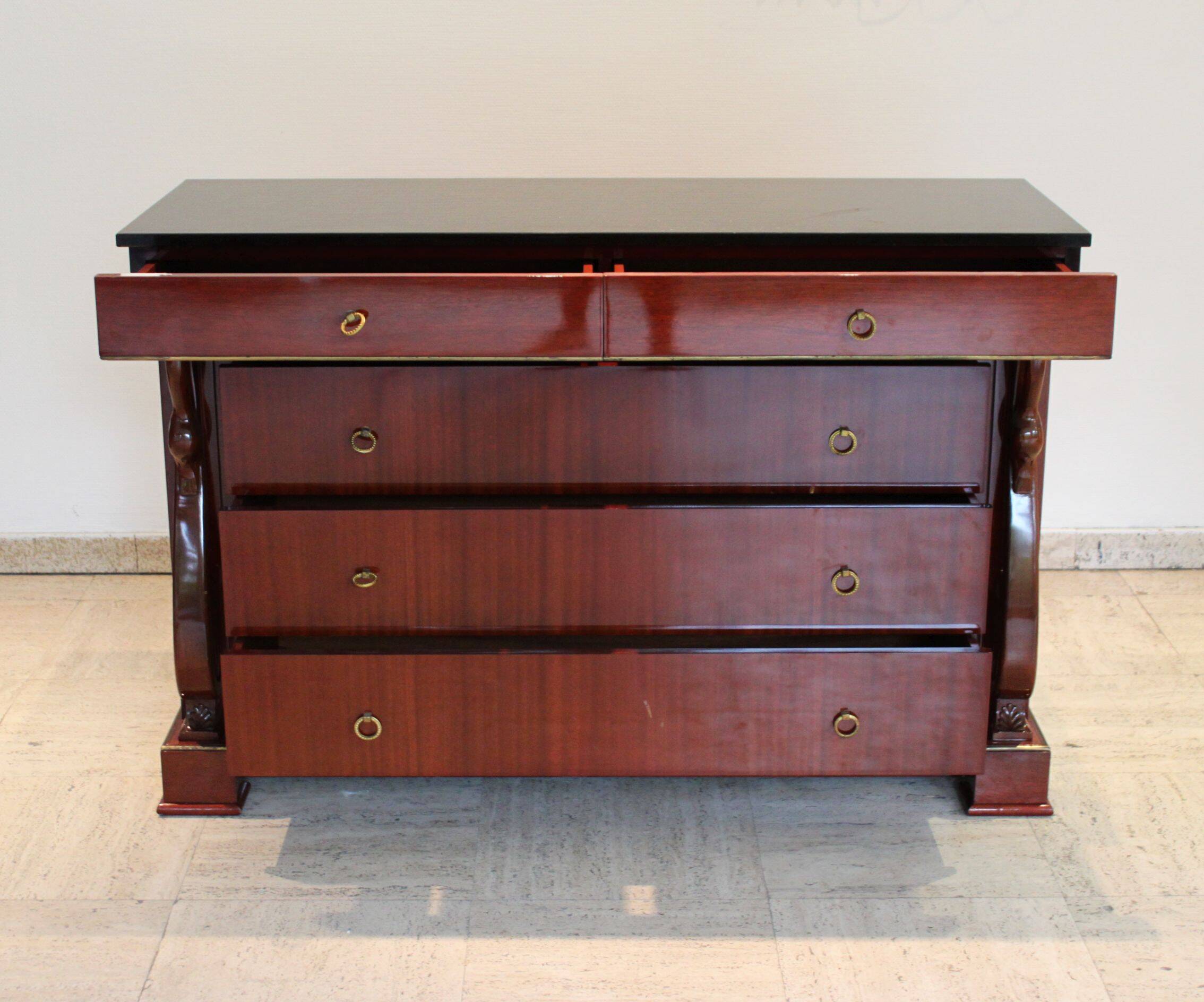 Mahogany “swan neck” chest of drawers, Empire style, 19th century.