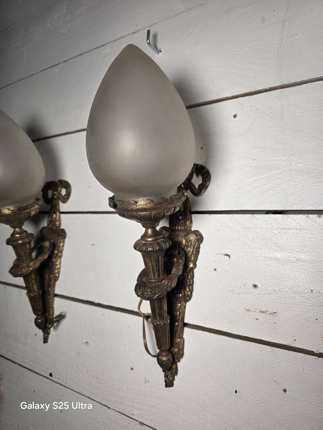 Pair of torch wall lights in Louis XVI style in 19th-century bronze.