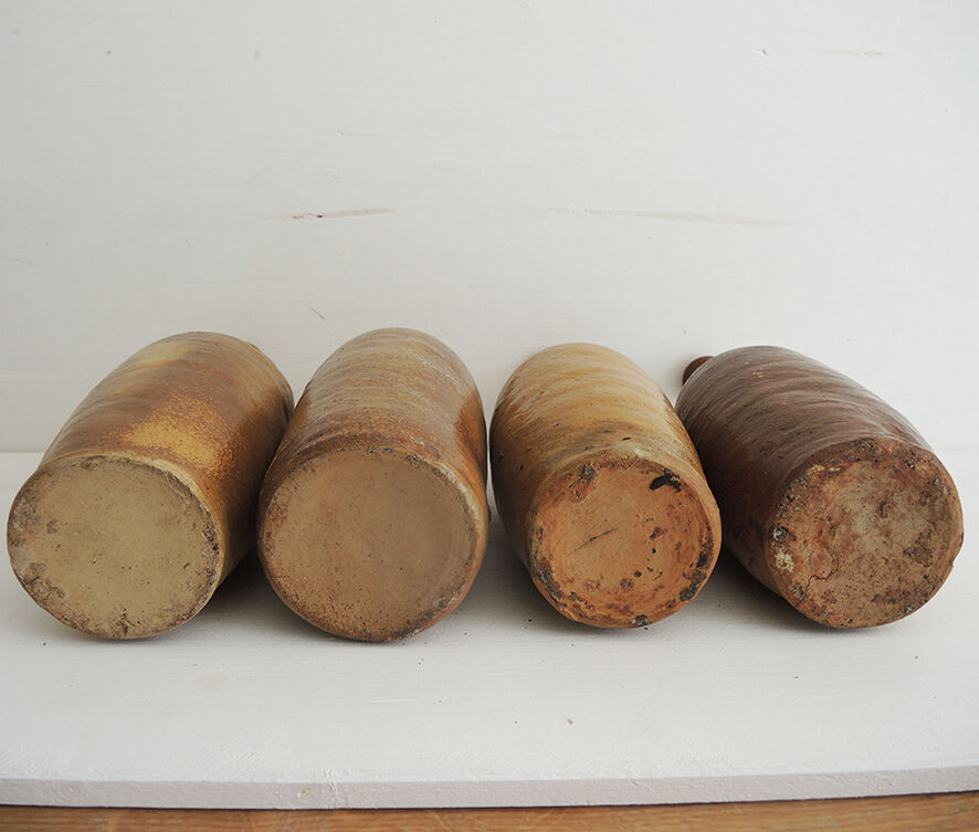 4 old stoneware bottles