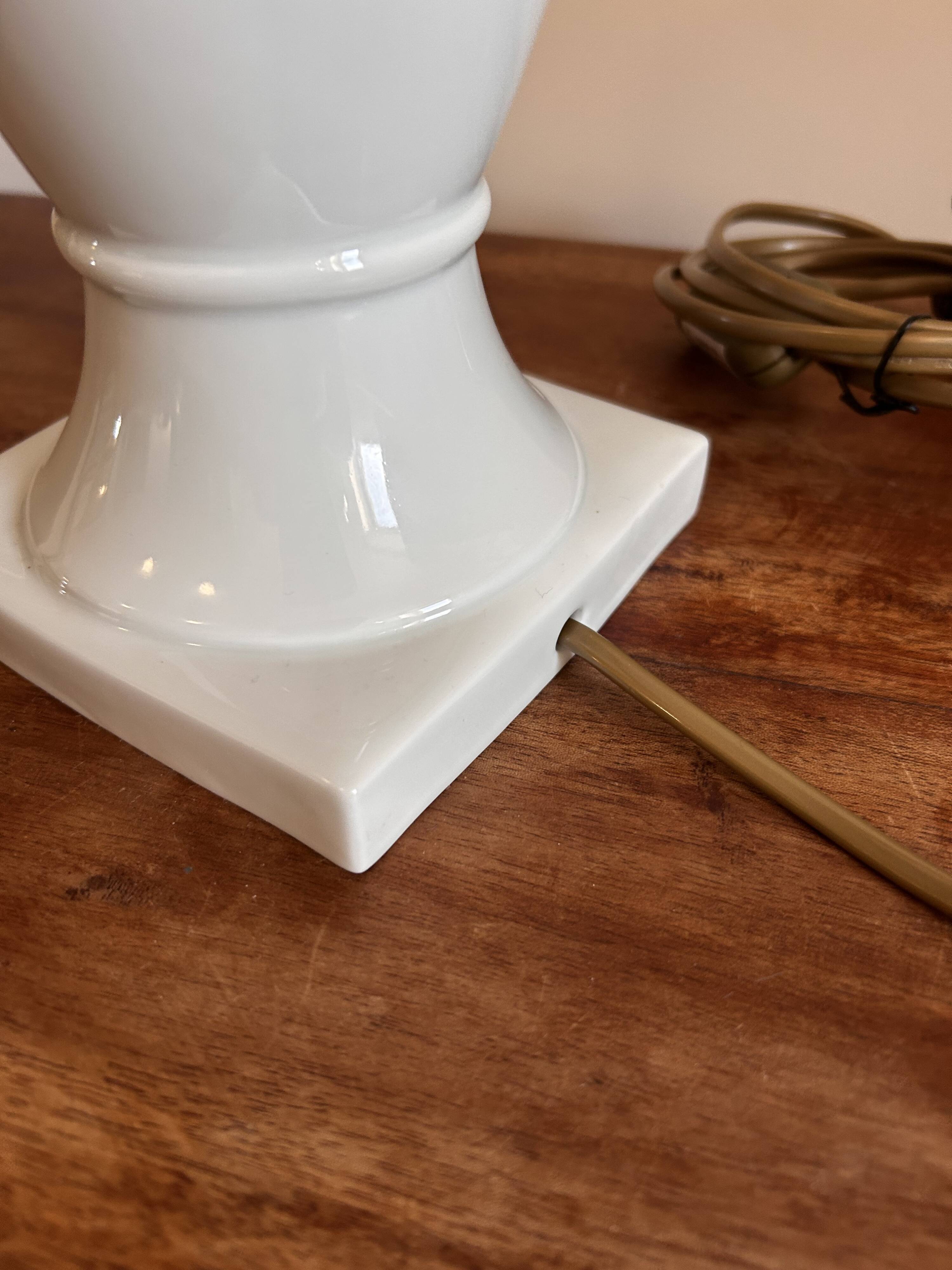 White ceramic table lamp with pastel shade