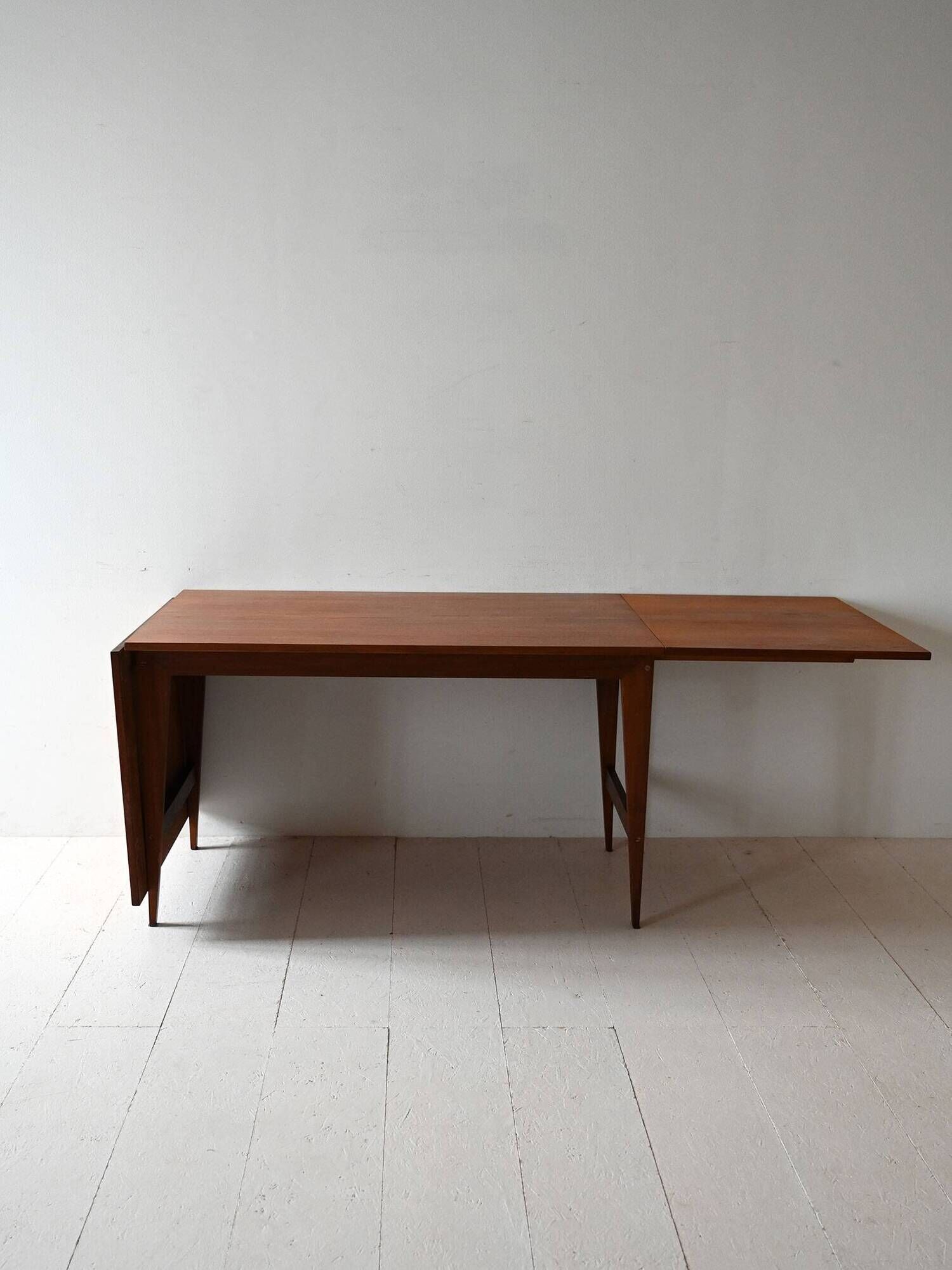 Vintage teak table by ISA Bergamo with drop-leaf extensions