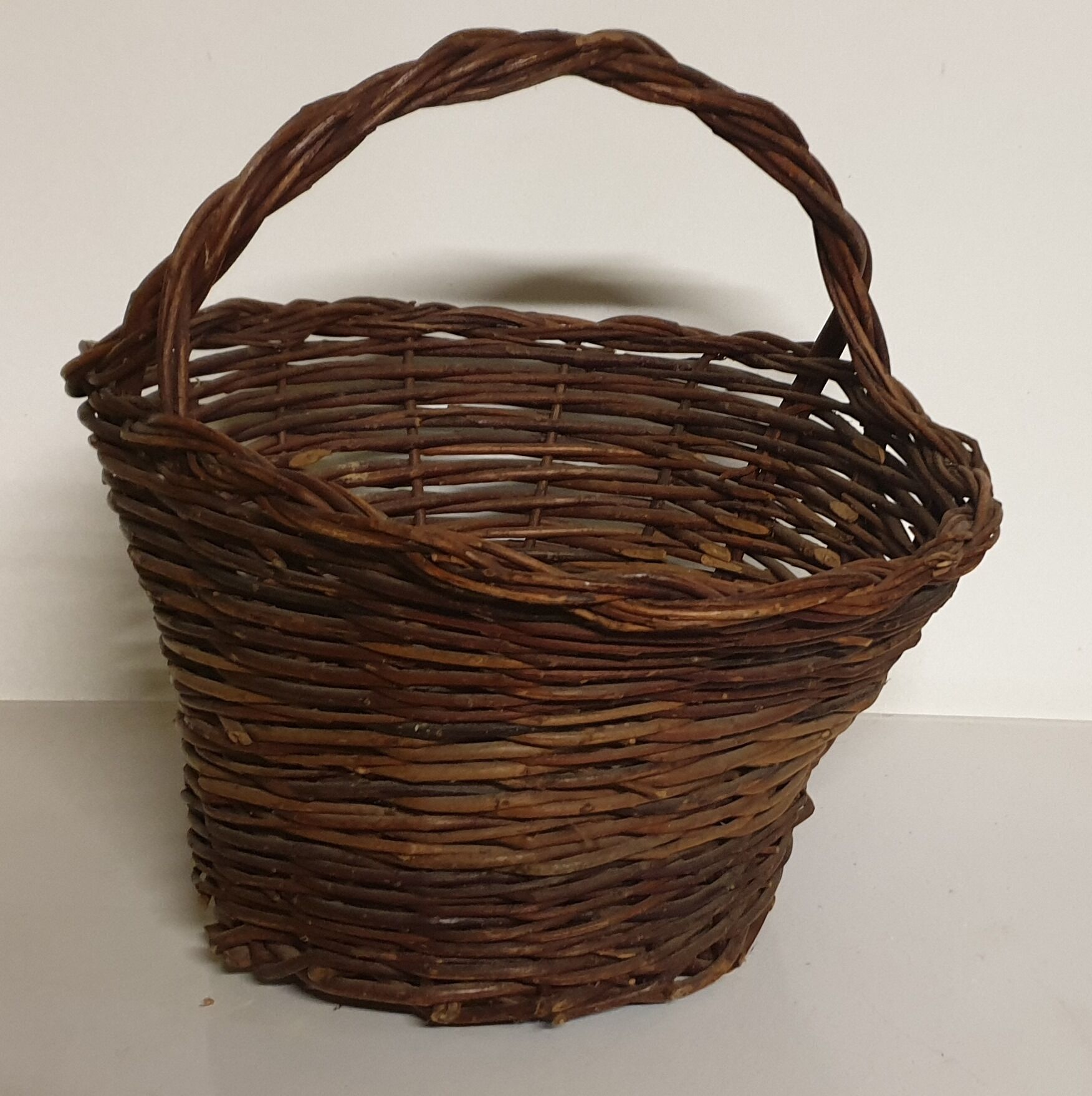 Rustic basket made of raw wicker