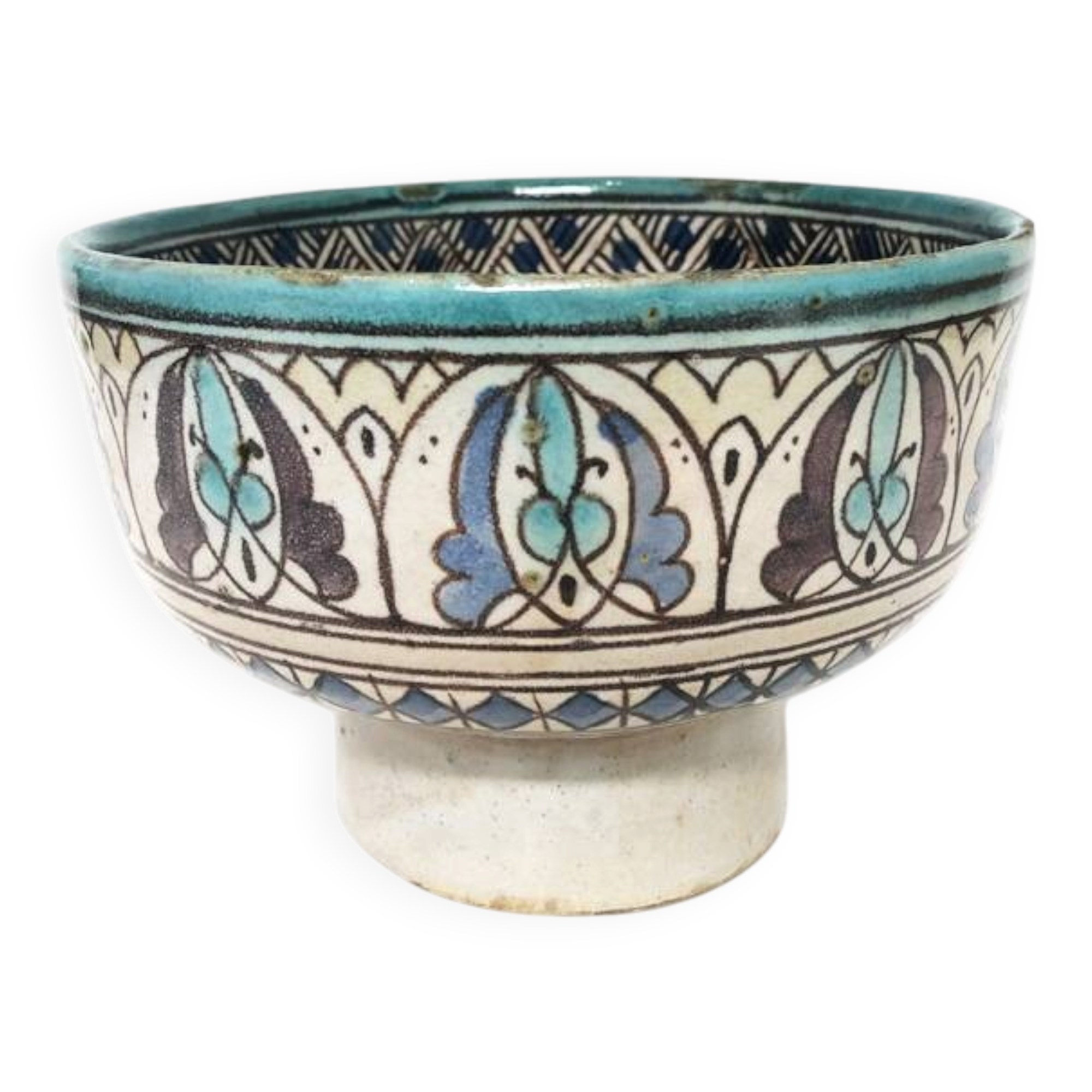 Cup on a ceramic pedestal – blue and turquoise geometric design.