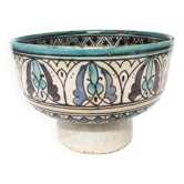 Cup on a ceramic pedestal – blue and turquoise geometric design.