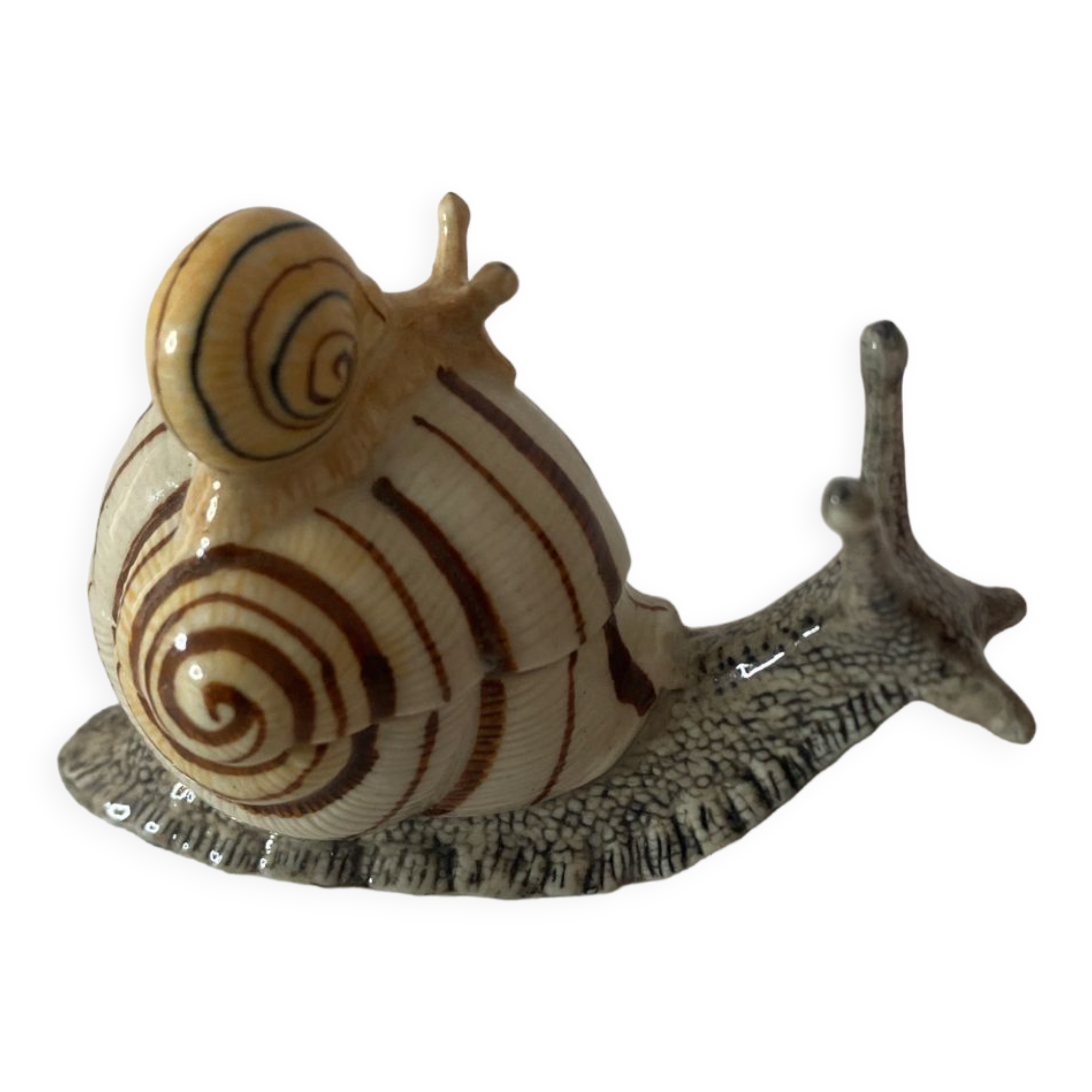 Porcelain figurine snail and its small