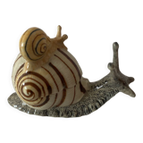 Porcelain figurine snail and its small