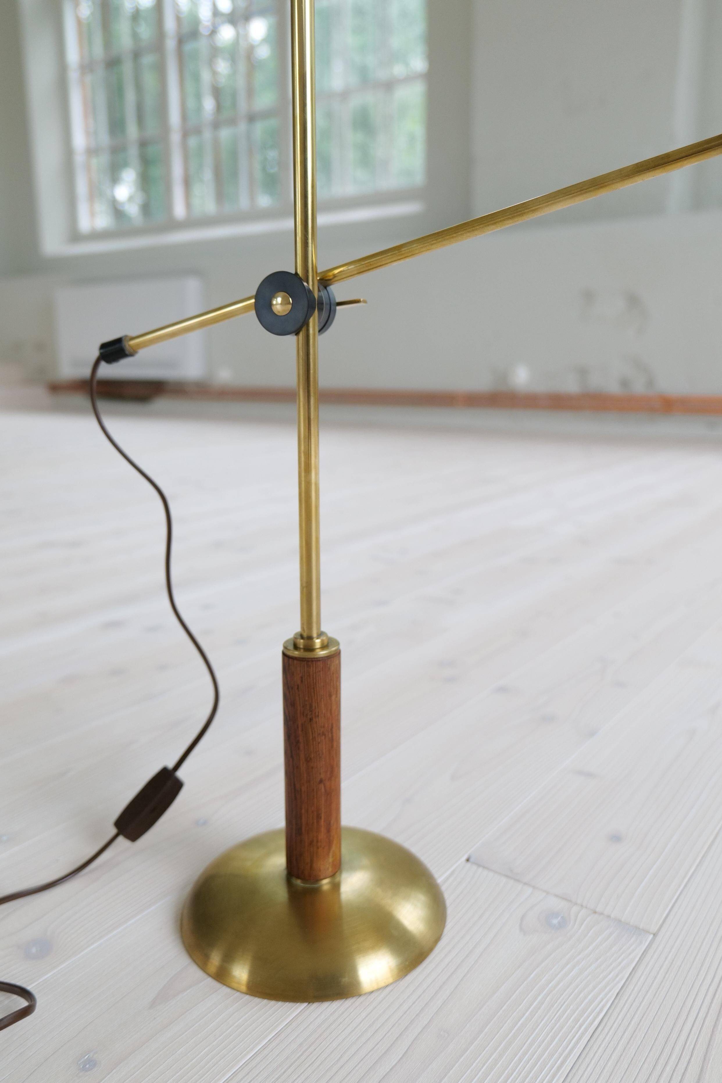Mid-century modern table lamp in brass and walnut, rare by Einar Bäckström, Sweden.