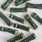 12 vintage green and gold ceramic knife holders from the 50s