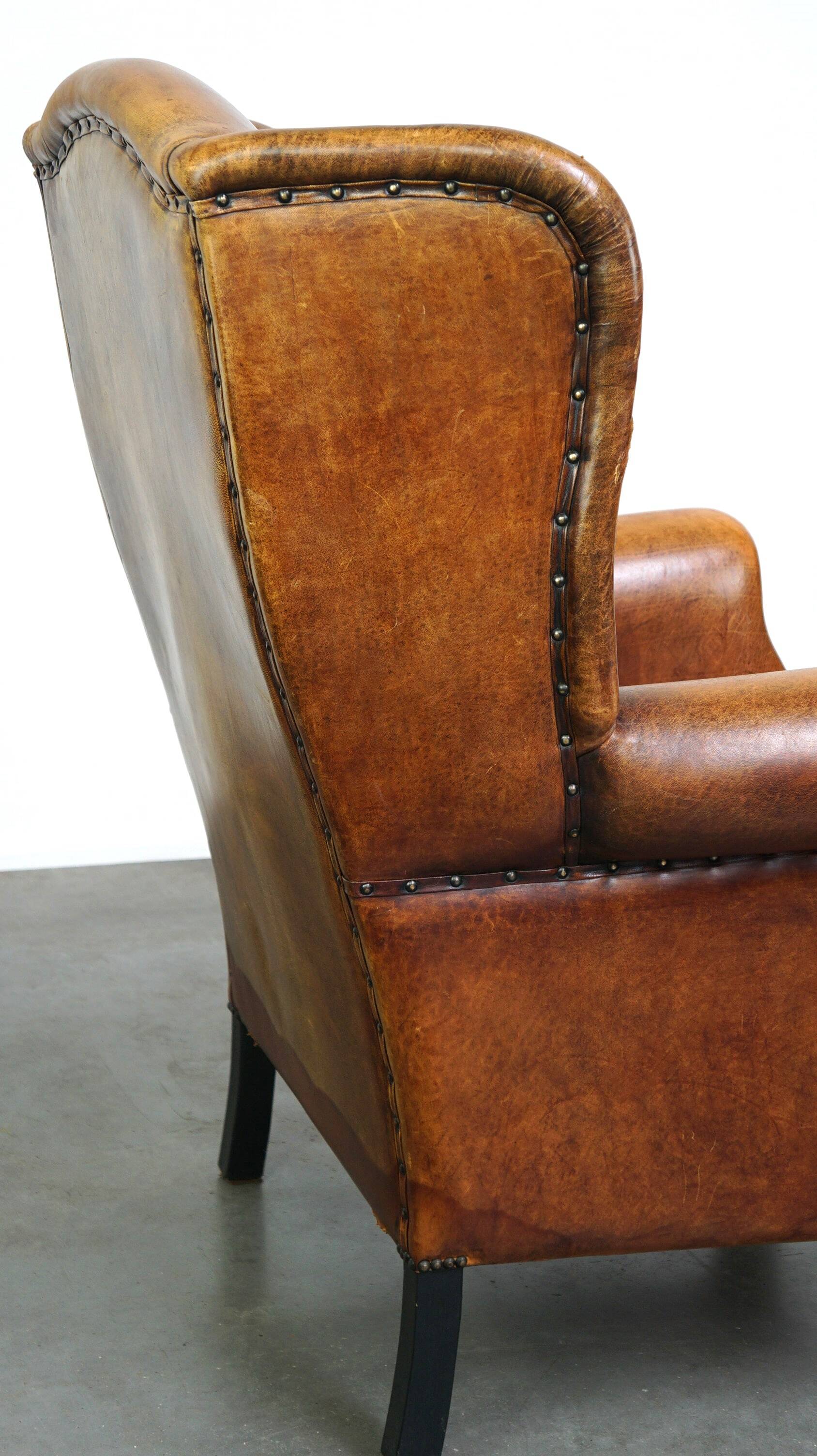 Sheepskin leather chair with a beautiful patina