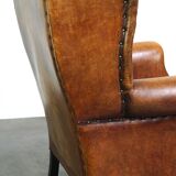 Sheepskin leather chair with a beautiful patina