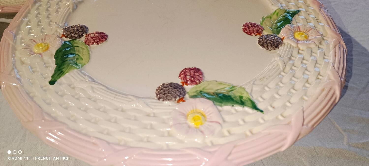 Footed dessert plate in barbotine porcelain, marked FG.