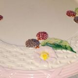 Footed dessert plate in barbotine porcelain, marked FG.