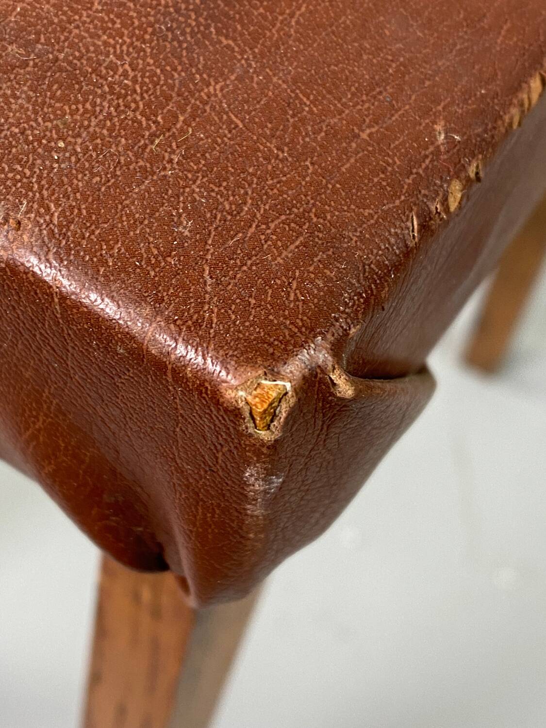 Small stool or footrest in wood and leather