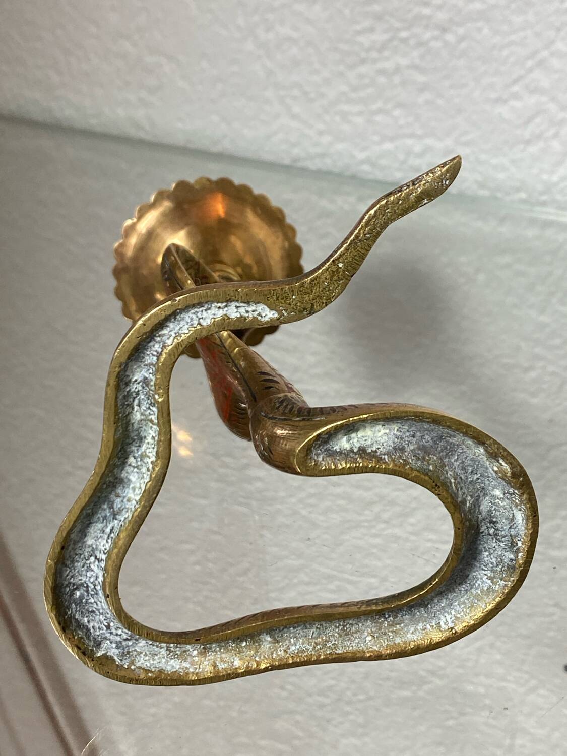 Chiseled brass cobra candlestick