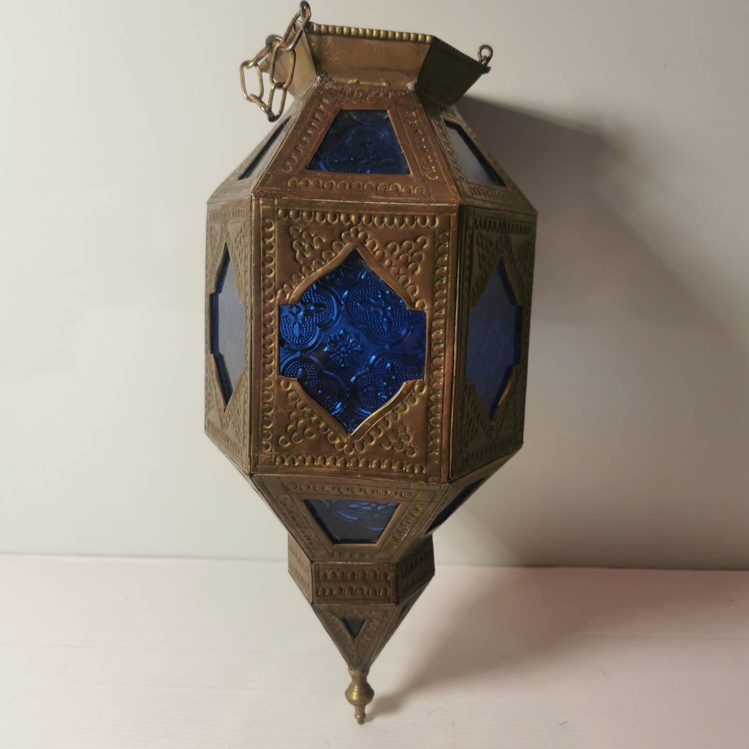 Oriental style hanging lantern in brass and dark blue glass