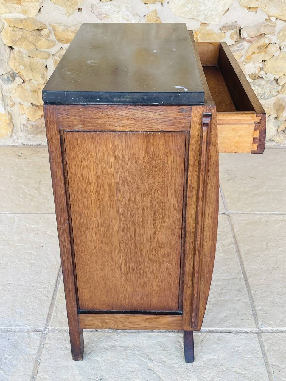 Art Deco bedside table in walnut, black marble top, circa 1920.