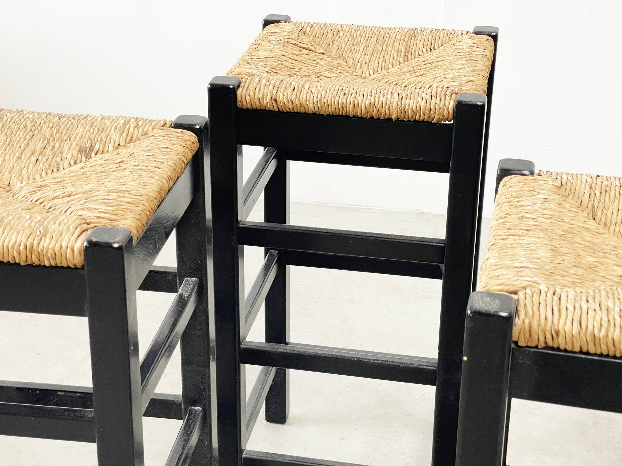 set of four rattan and wood barstools