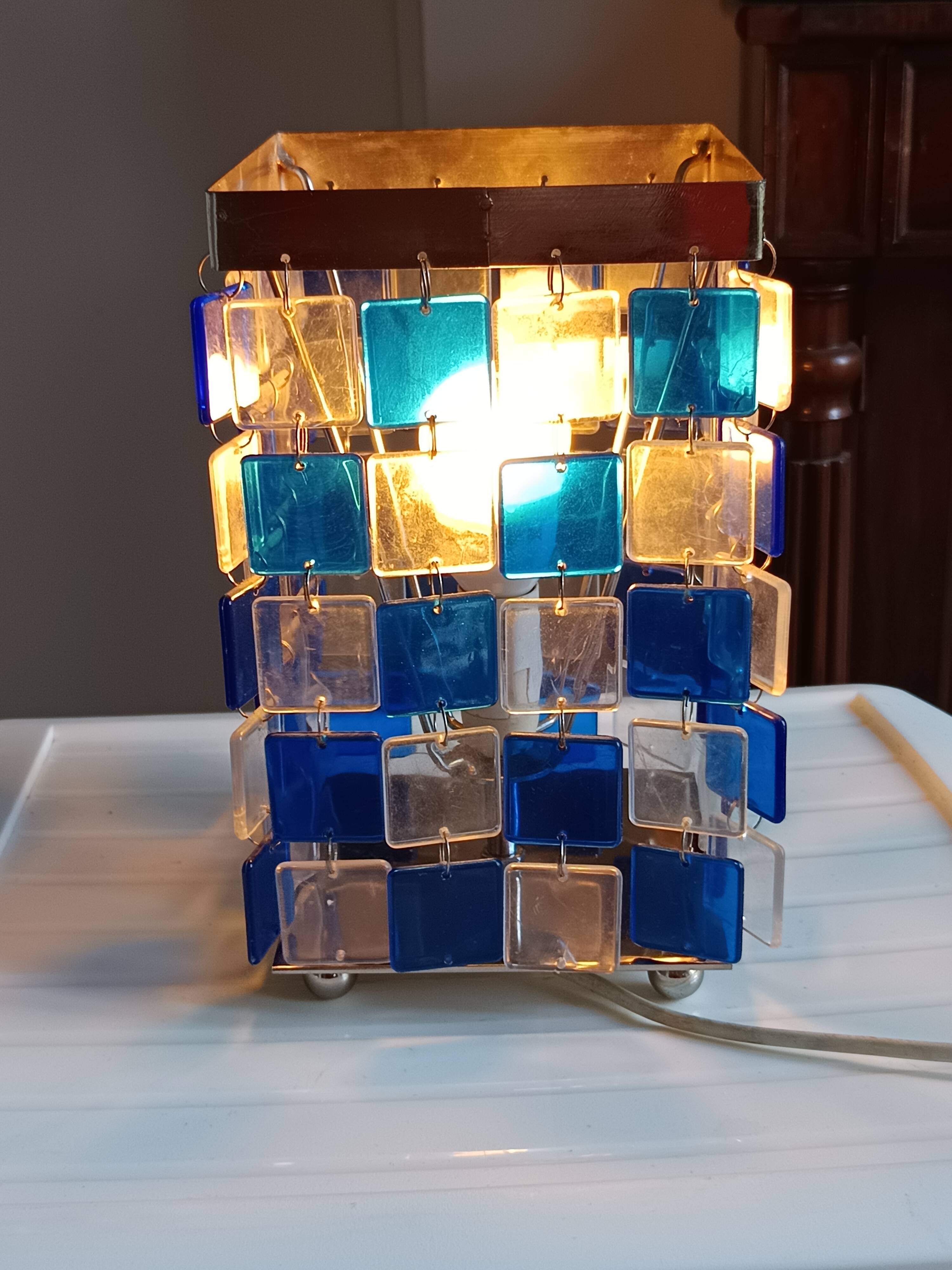 1970s designer table lamp with blue and clear plexiglass pendants.