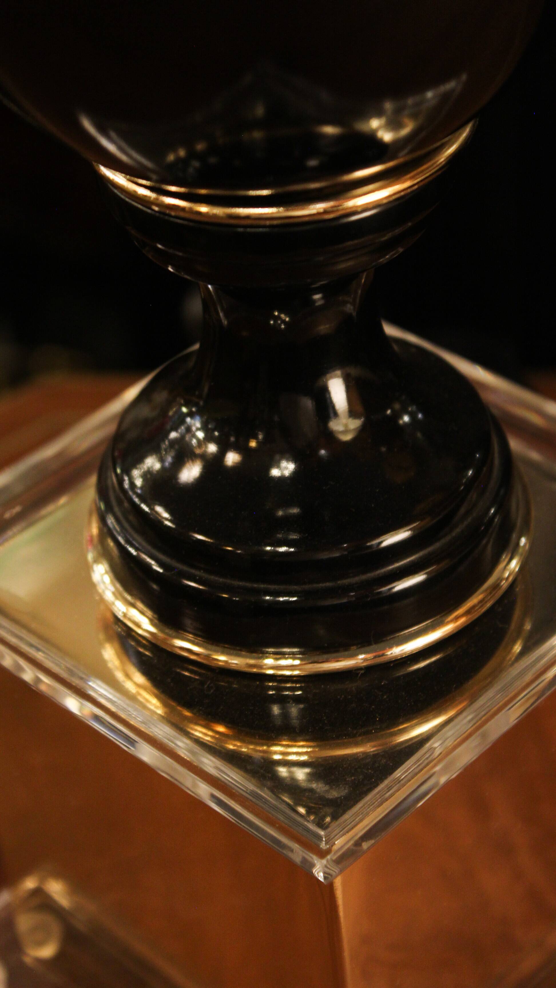 Black lamp in Hollywood Regency style