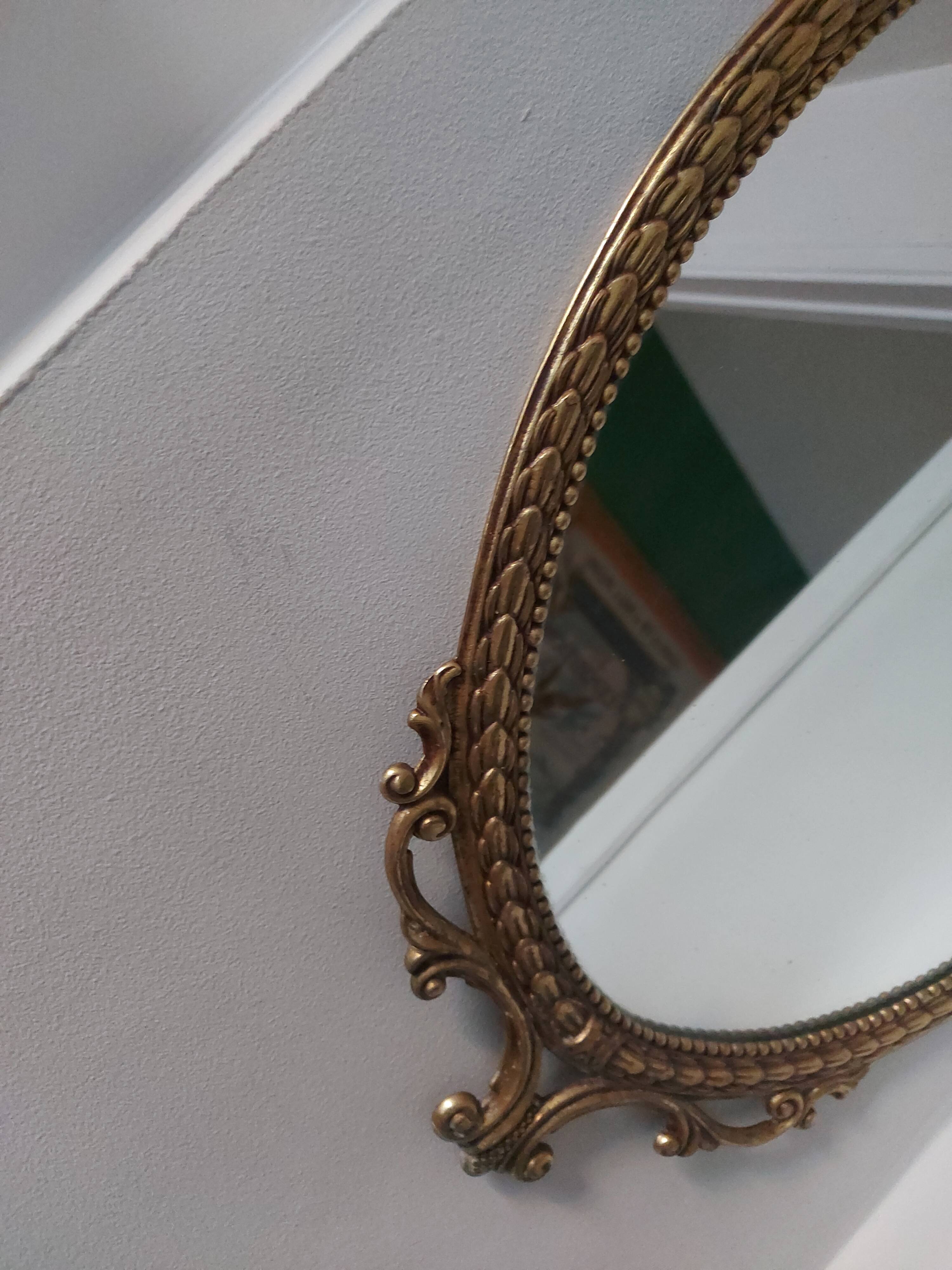 Baroque mirror in gilded brass, C.G.R