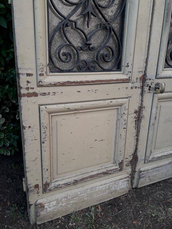 19th century double arched entrance door in oak with grilles and old glass