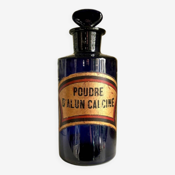 Calcined alum powder apothecary bottle in blue glass