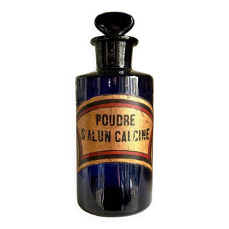 Calcined alum powder apothecary bottle in blue glass