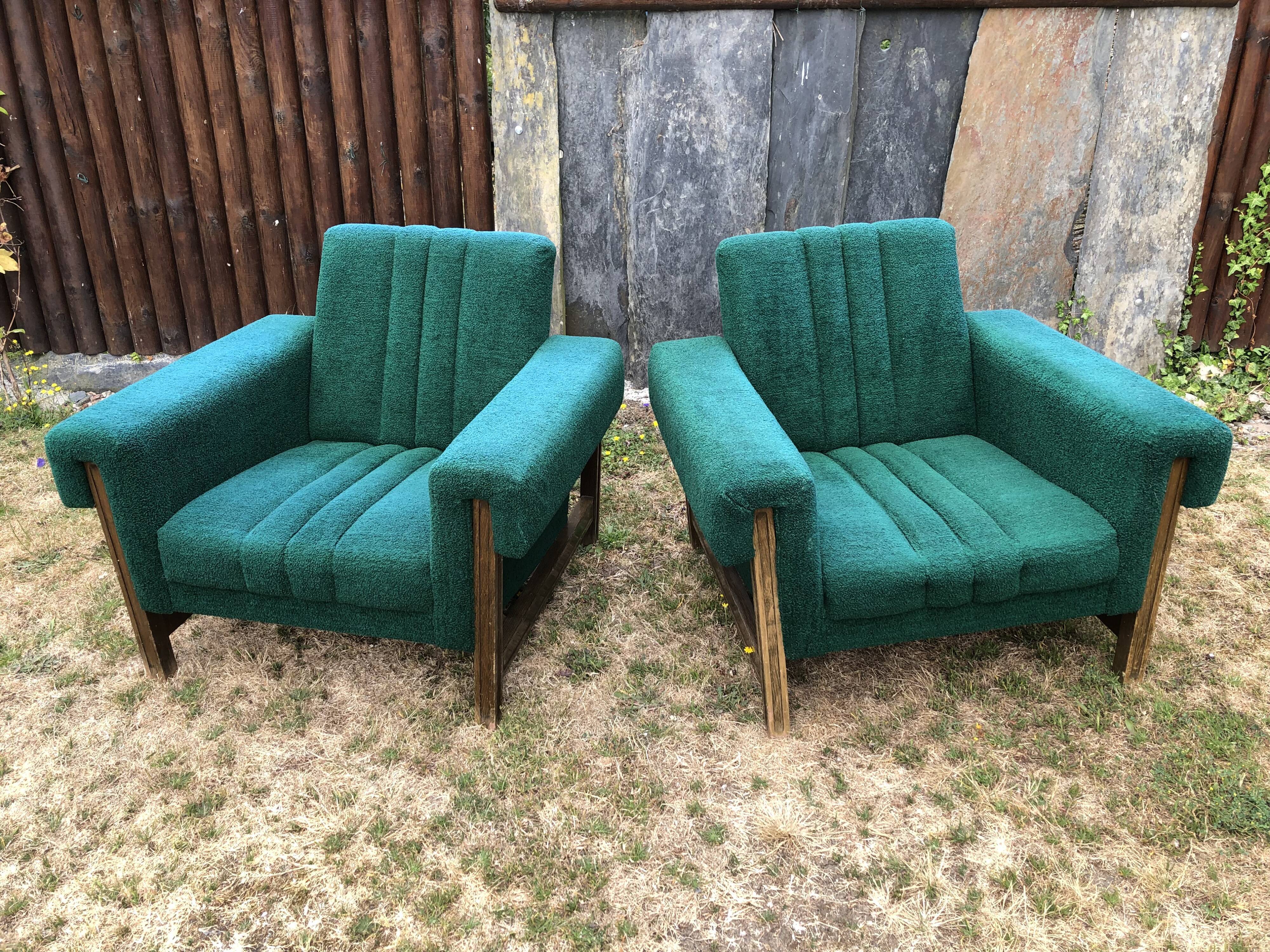 Duo of vintage armchairs with green fabrics.