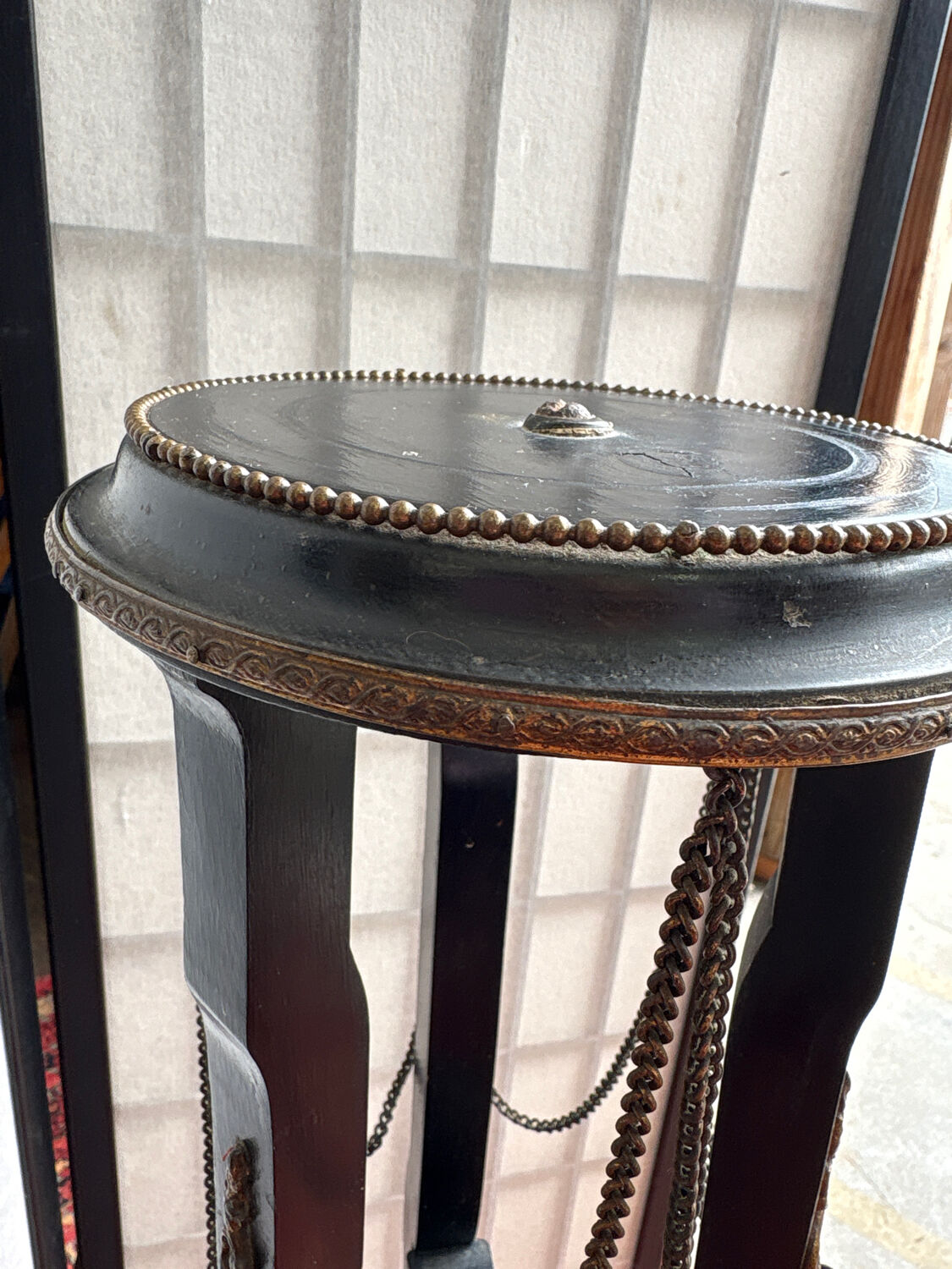 Napoleon III side table in blackened wood and bronze, decorated with chains, 19th century.