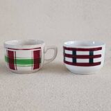 2 mismatched iron earth cups