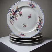 4 flat plates by Bernardaud, Limoges porcelain, floral decoration from the 1920s to 1950s.