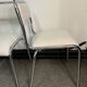 Pair of chrome chairs upholstered in boucle fabric.
