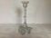 Thick moulded glass candlestick with fish and flowers.