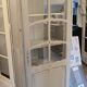 Antique glass-fronted cabinet in pearl grey – country house spirit