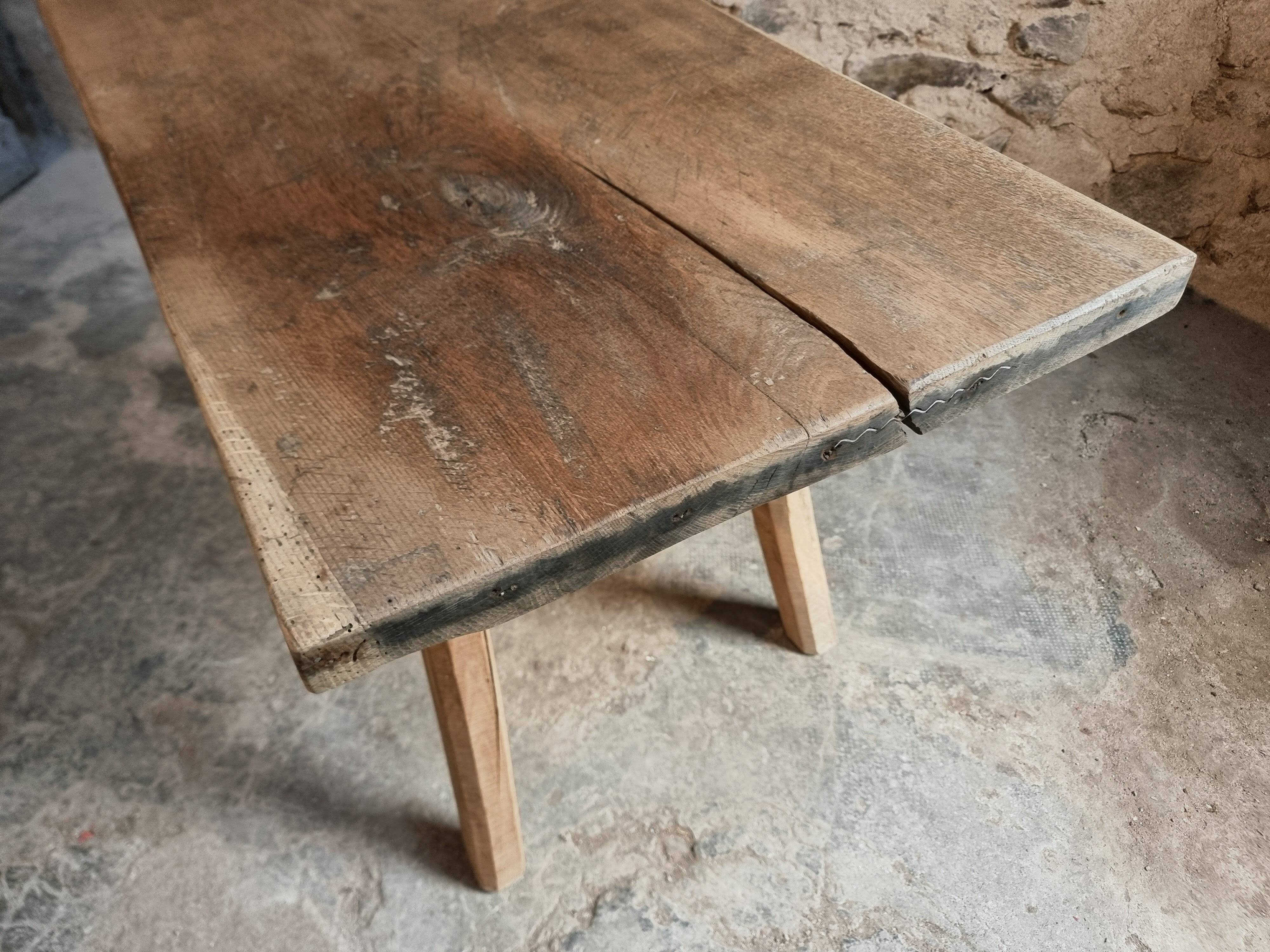Antique work table / primitive dining table in oak, Hungary, circa 1900–1930.